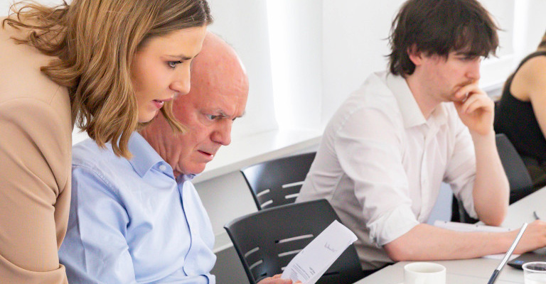 Solicitors using technology together