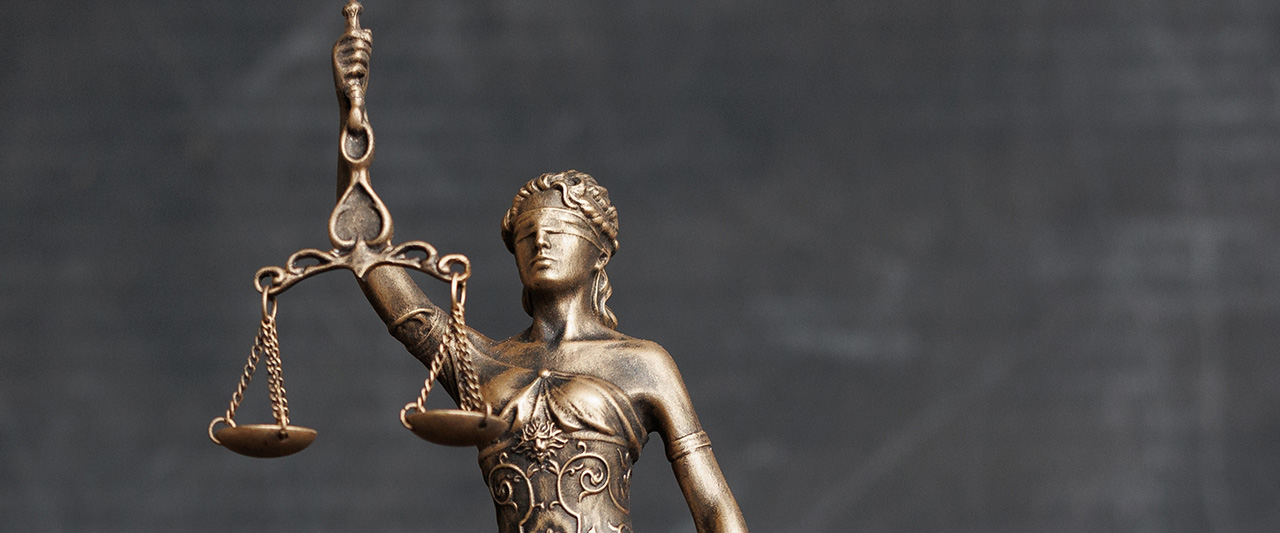 A bronze statue of Lady Justice