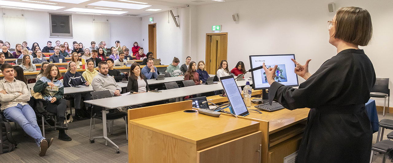 A lecture in progress at Blackhall Place, Dublin. A female speaker is giving a lecture to an engaged audience of trainee solicitors