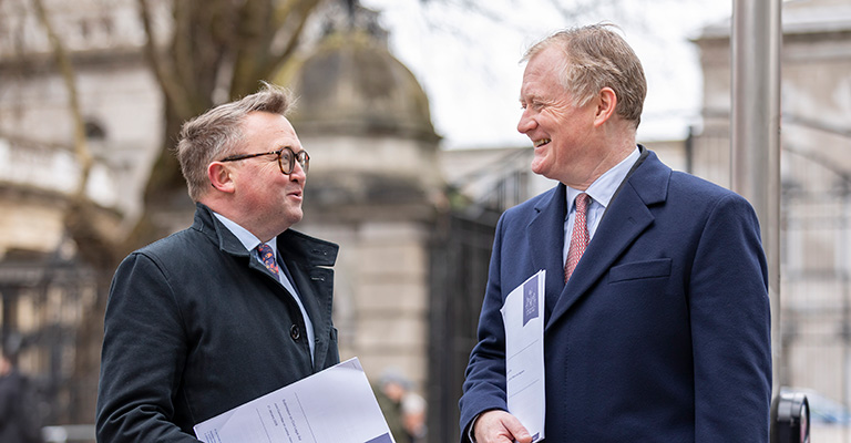Dr Brian Hunt, Law Society Director of Policy, in conversation with a Law Society expert at Leinster House